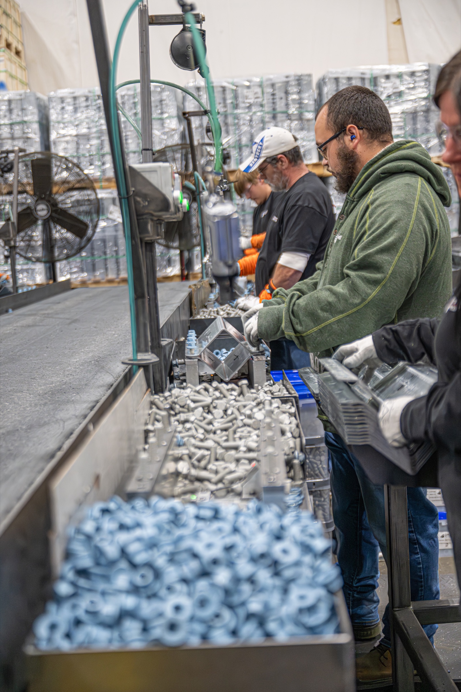 Big Rapids Products assembly team working on metal components