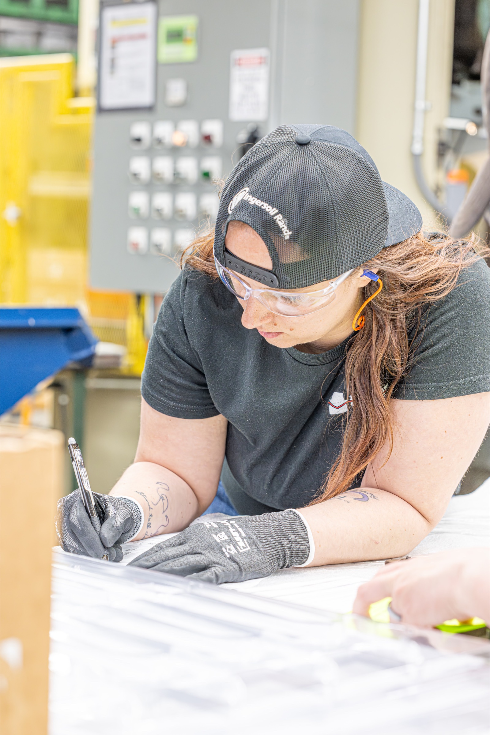 Big Rapids Products team member reviewing production documentation